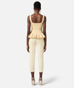 Top in maglia a pieghe con baschina